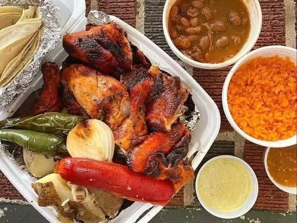 Charcoal-grilled chicken with sides